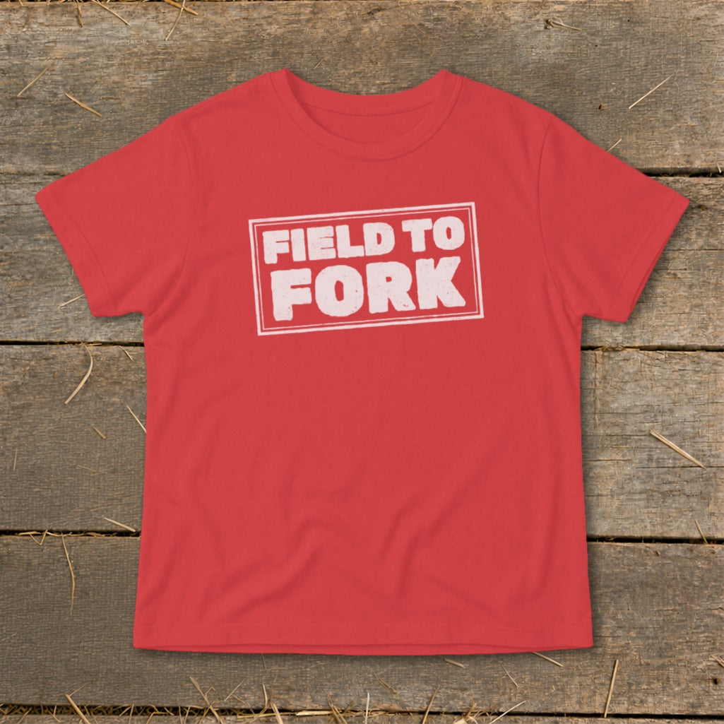 A red t-shirt with the white text "FIELD TO FORK" centered on the chest.