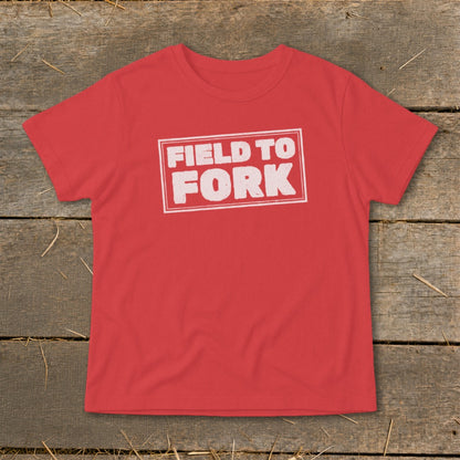 A red t-shirt with the white text "FIELD TO FORK" centered on the chest.