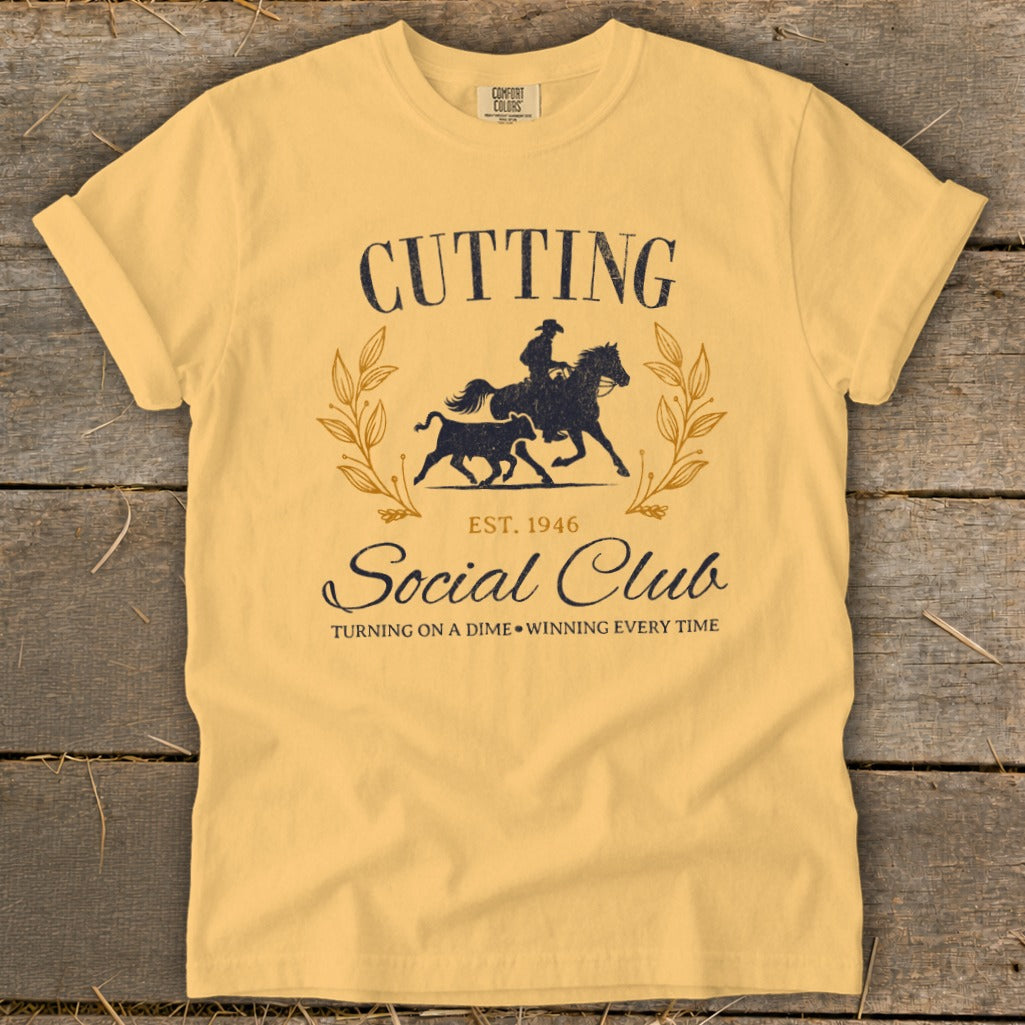 Yellow t-shirt with "Cutting Social Club est. 1946" and cowboy on horse chasing bull.