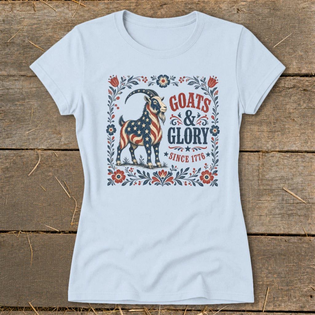 Light blue t-shirt with a goat design featuring "GOATS & GLORY SINCE 1776" text.