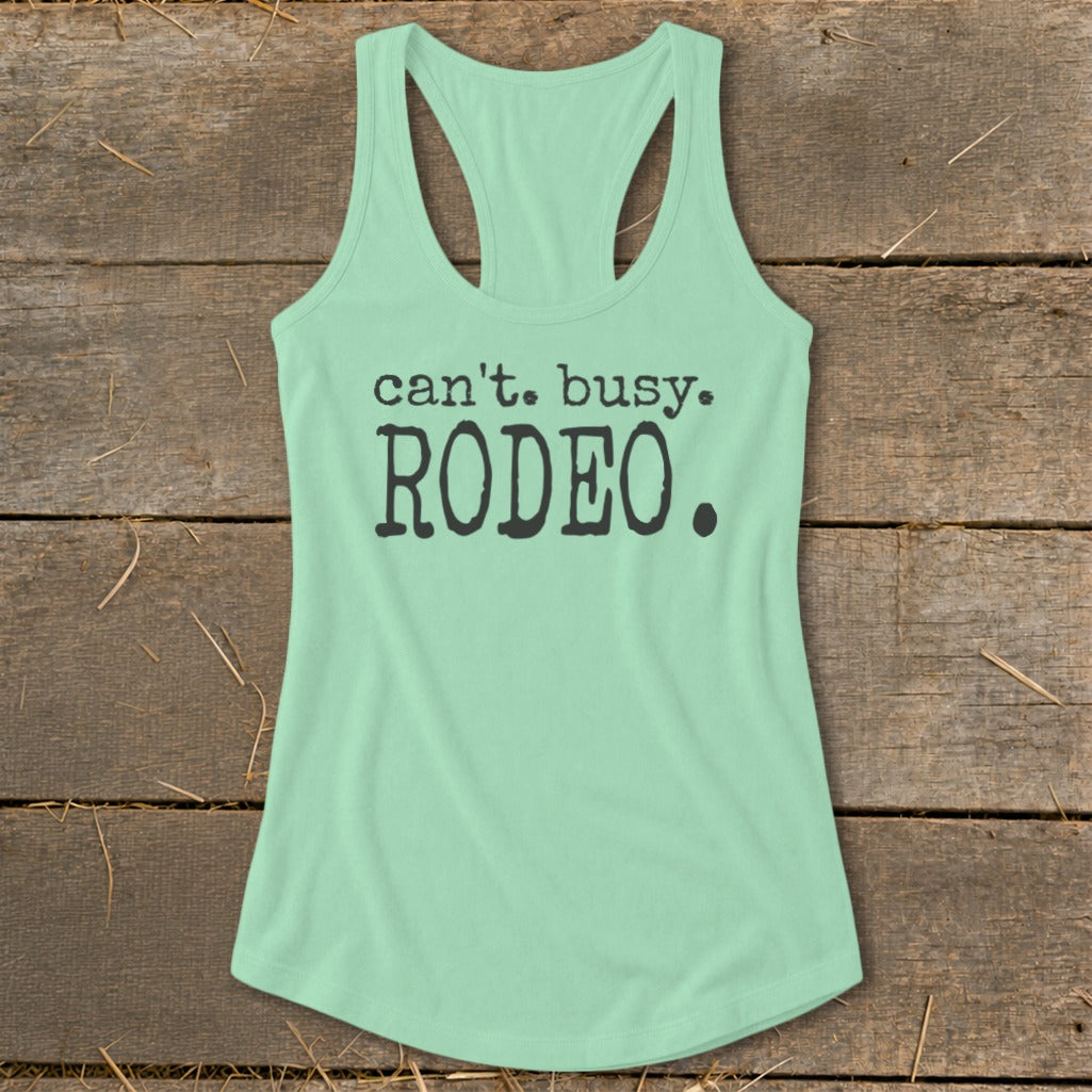 Mint green racerback tank top with "can't. busy. RODEO." text.