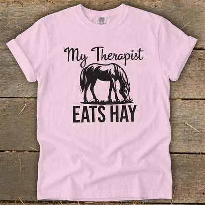 Pink t-shirt with "My Therapist Eats Hay" and a horse graphic.