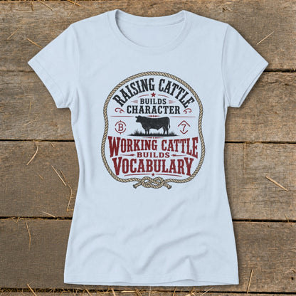 Light blue t-shirt with a circular graphic about raising and working cattle.