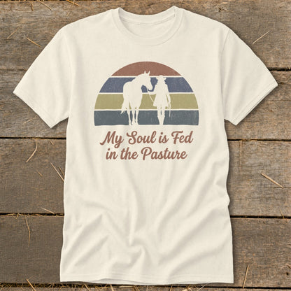 T-shirt with silhouette of horse and rider, text "My Soul is Fed in the Pasture".