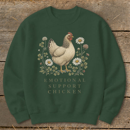 Green sweatshirt with a white chicken illustration surrounded by clover and daisies, text reads "EMOTIONAL SUPPORT CHICKEN".