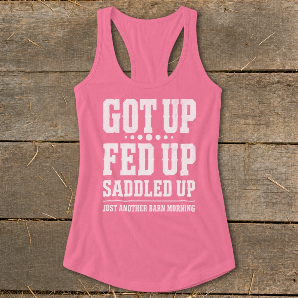 Pink tank top with white text "GOT UP FED UP SADDLED UP JUST ANOTHER BARN MORNING".
