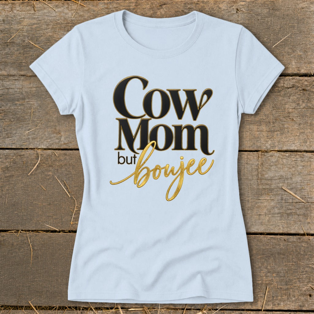 Light blue t-shirt with black and gold text that reads "Cow Mom but boujee."