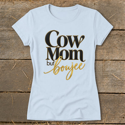 Light blue t-shirt with black and gold text that reads "Cow Mom but boujee."