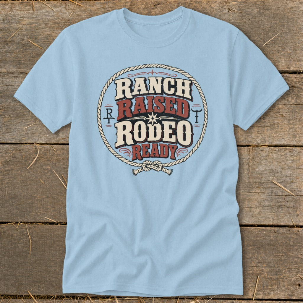 Light blue t-shirt with "Ranch Raised Rodeo Ready" text inside a rope circle.