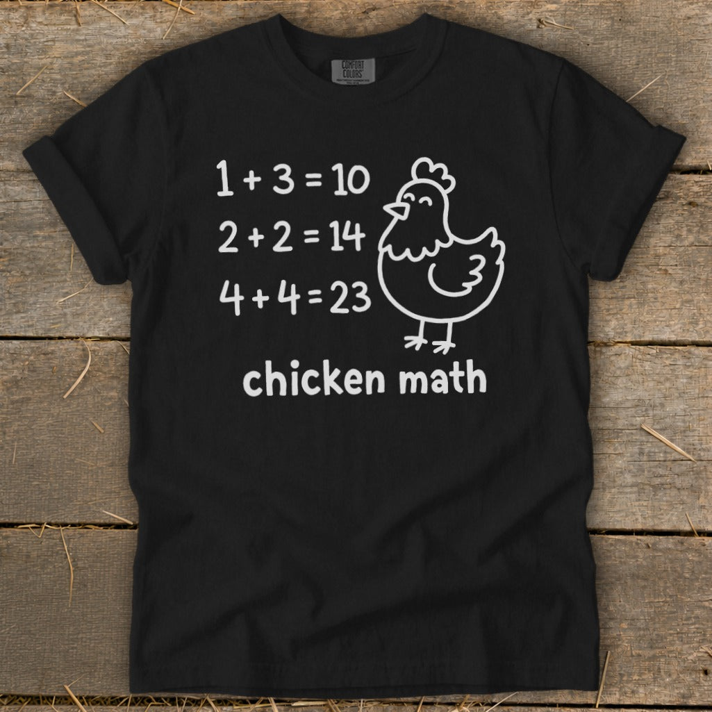 Black t-shirt with white text and chicken graphic: "1+3=10, 2+2=14, 4+4=23 chicken math."