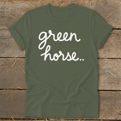 Green short-sleeved t-shirt with "green horse..." in white cursive text.