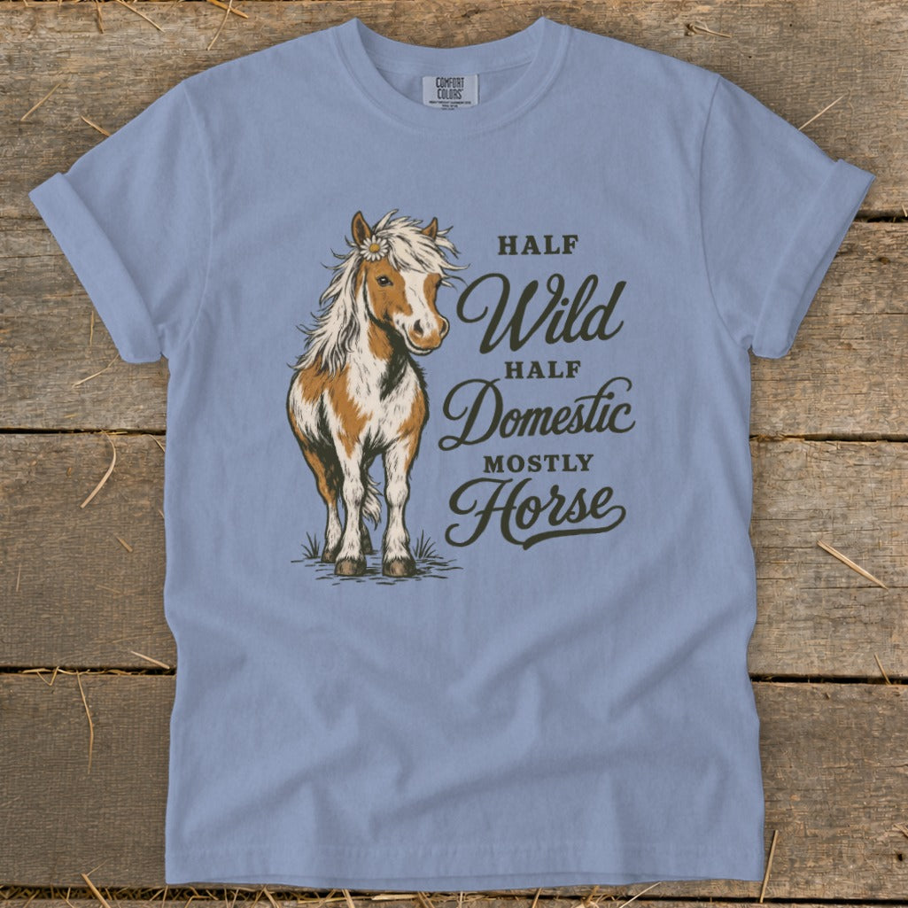 Light blue t-shirt with a horse graphic and text "Half Wild, Half Domestic, Mostly Horse".