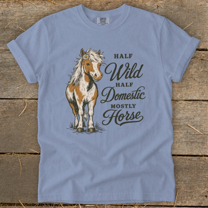 Light blue t-shirt with a horse graphic and text "Half Wild, Half Domestic, Mostly Horse".