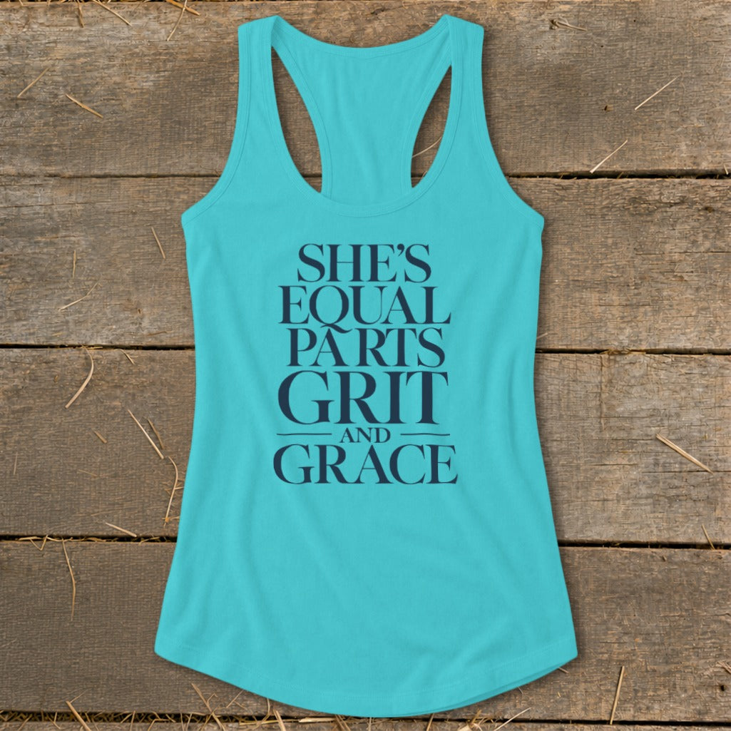 Turquoise tank top with dark blue text that reads "SHE'S EQUAL PARTS GRIT AND GRACE".