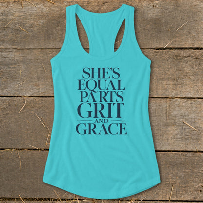 Turquoise tank top with dark blue text that reads "SHE'S EQUAL PARTS GRIT AND GRACE".
