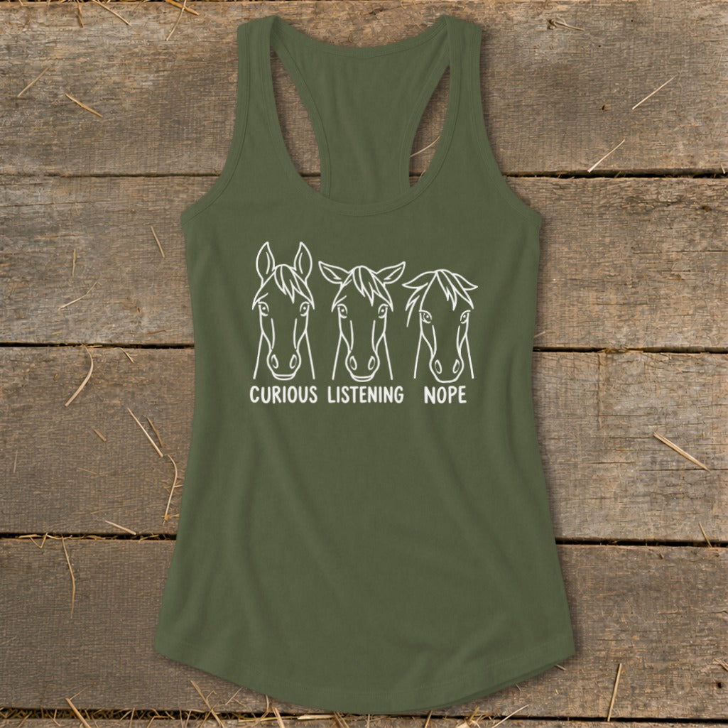 An olive green racerback tank top featuring white line art of three horses labeled Curious, Listening, and Nope.