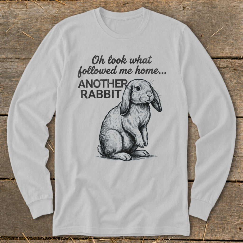 White long-sleeve shirt with a sketch of a rabbit and text "Oh look what followed me home... ANOTHER RABBIT".