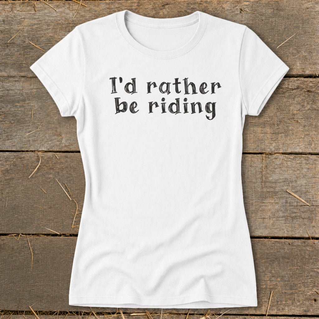 White t-shirt with "I'd rather be riding" text printed in black, distressed font.