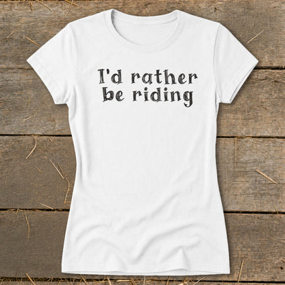 White t-shirt with "I'd rather be riding" text printed in black, distressed font.