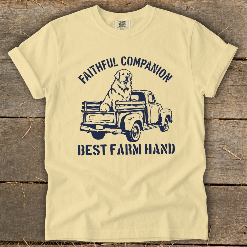 Light yellow t-shirt with navy graphic of a dog in a truck and text.