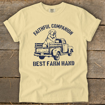Light yellow t-shirt with navy graphic of a dog in a truck and text.