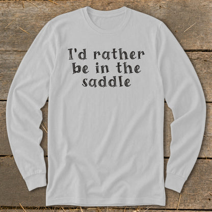 White long-sleeved shirt with black text reading "I'd rather be in the saddle."