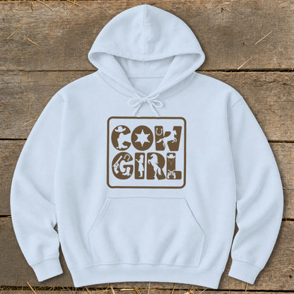 White hoodie with brown "Cowgirl" text featuring western icons.