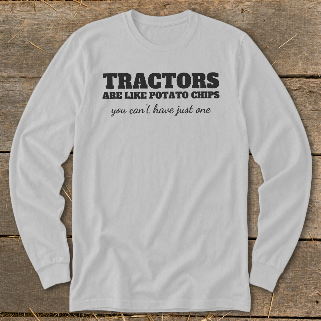 White long-sleeve shirt with black text: "TRACTORS ARE LIKE POTATO CHIPS you can't have just one".