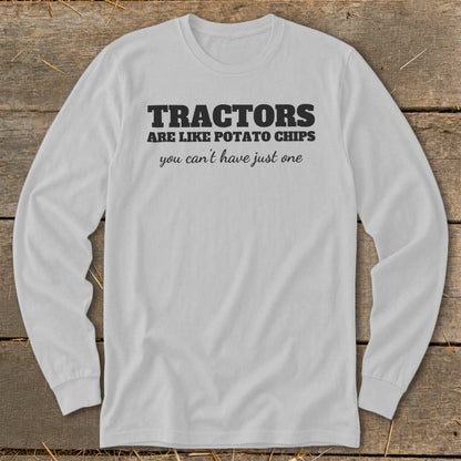 White long-sleeve shirt with black text: "TRACTORS ARE LIKE POTATO CHIPS you can't have just one".