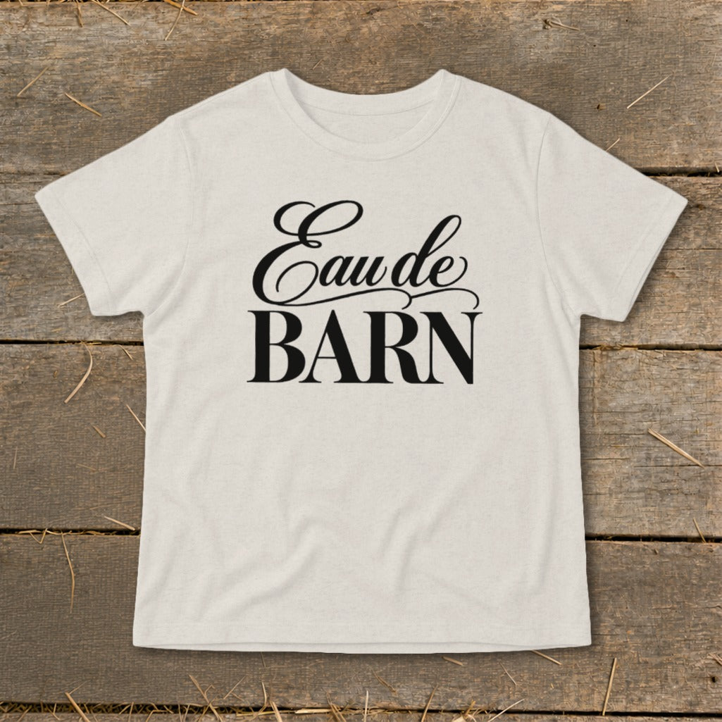Light-colored t-shirt with "Eau de BARN" text in black script and serif fonts.