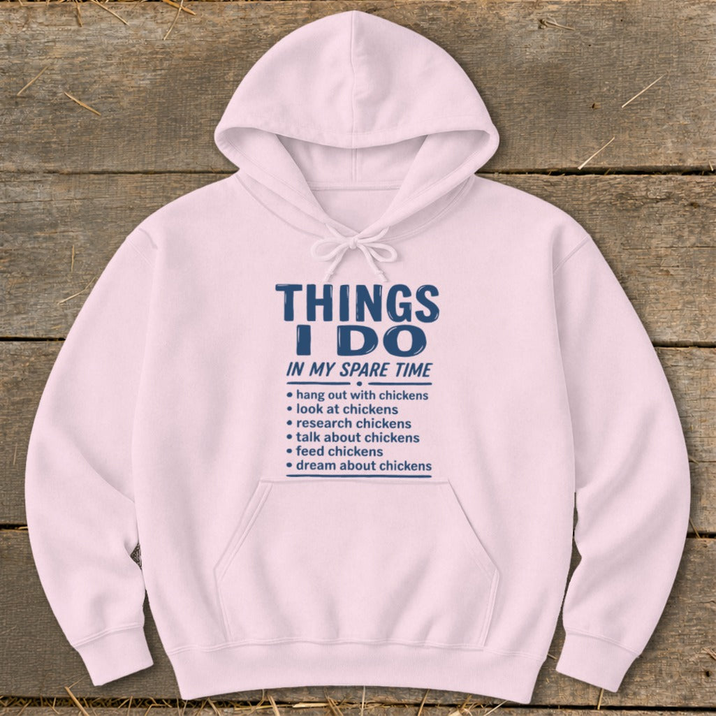 Pink hoodie with text listing chicken-related activities in spare time.