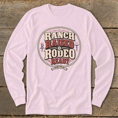 Long-sleeved pink shirt with "Ranch Raised Rodeo Ready" graphic.