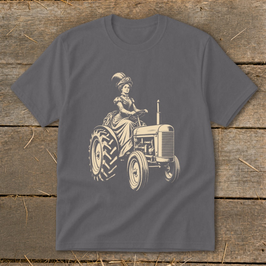 Victorian woman in dress and feathered hat driving a tractor.