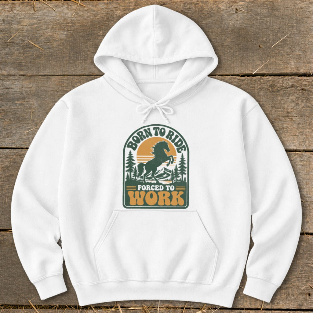 White hoodie with graphic design featuring a horse, mountains, trees, and text "BORN TO RIDE FORCED TO WORK".