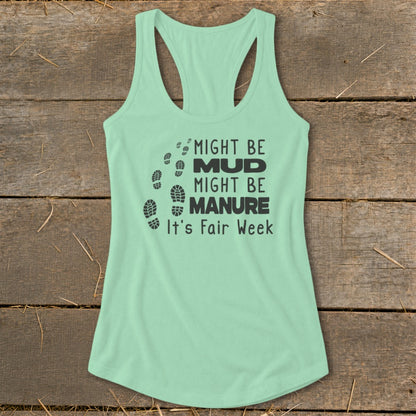 Mint green tank top with black text and footprints reading "Might Be Mud, Might Be Manure, It's Fair Week."