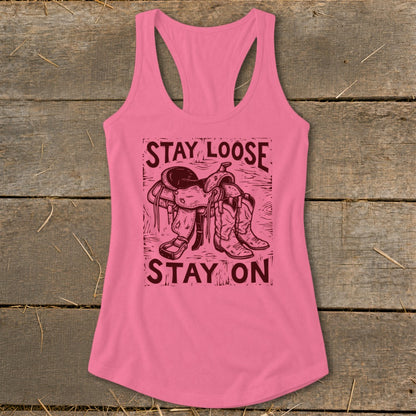 Pink tank top with "STAY LOOSE STAY ON" text and cowboy saddle and boots graphic.