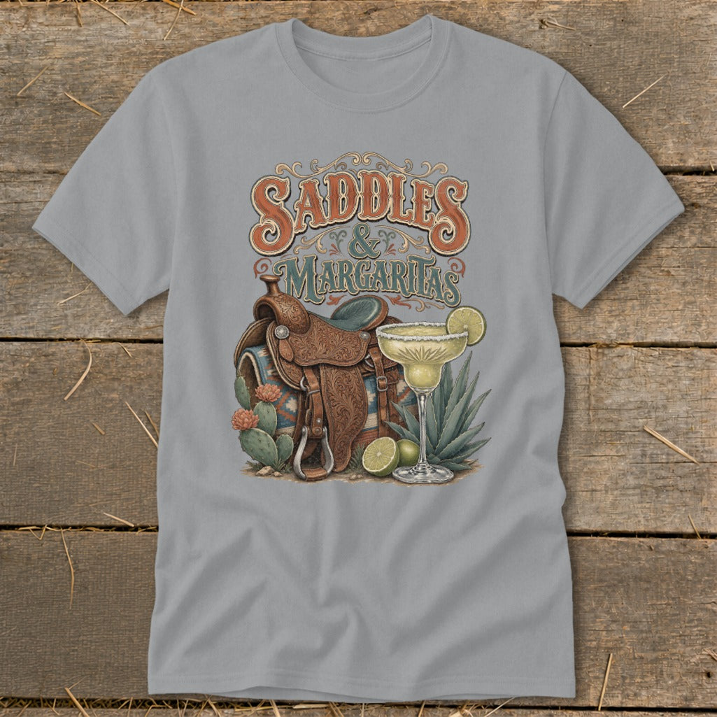 Saddles & Margaritas graphic on a grey t-shirt with Western saddle, margarita, and cacti.