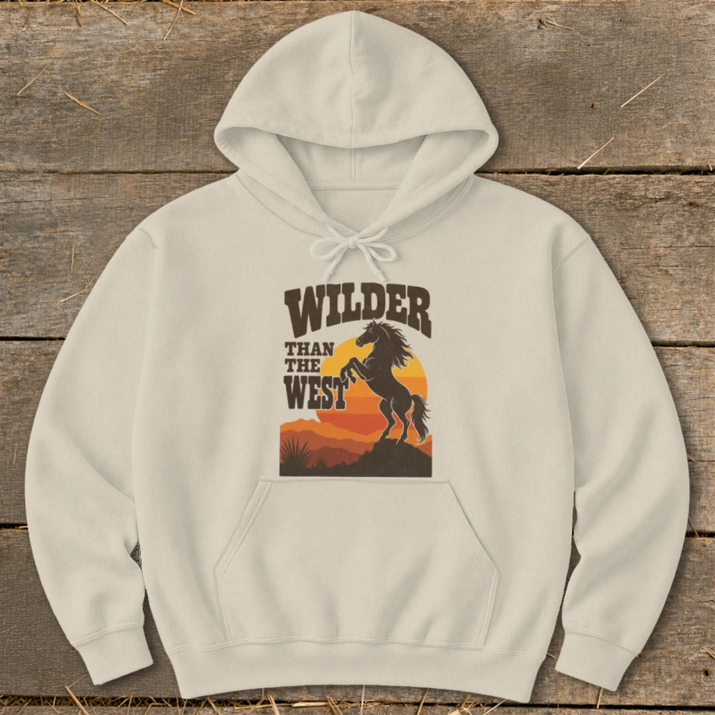 Cream hoodie with "Wilder Than The West" text and a silhouette of a rearing horse.