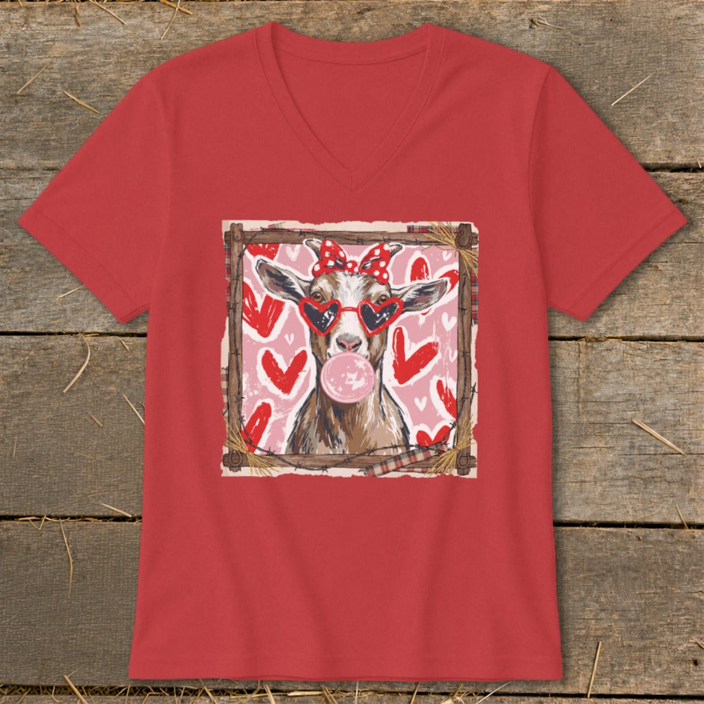 Goat wearing heart sunglasses and red bow blows bubblegum, surrounded by hearts.