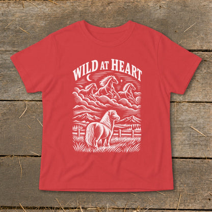 Red t-shirt with "Wild at Heart" text and horses in a mountainous landscape.