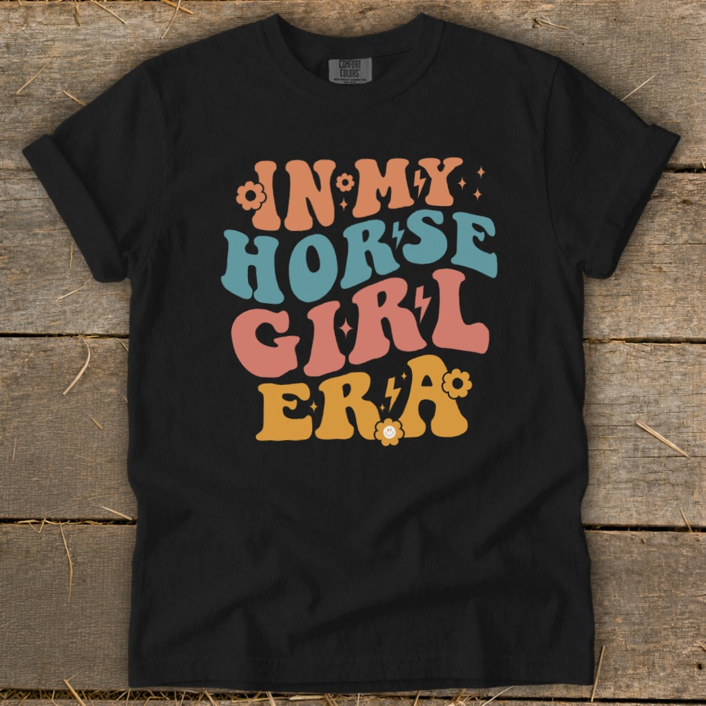 Black t-shirt with "IN MY HORSE GIRL ERA" text in retro fonts.