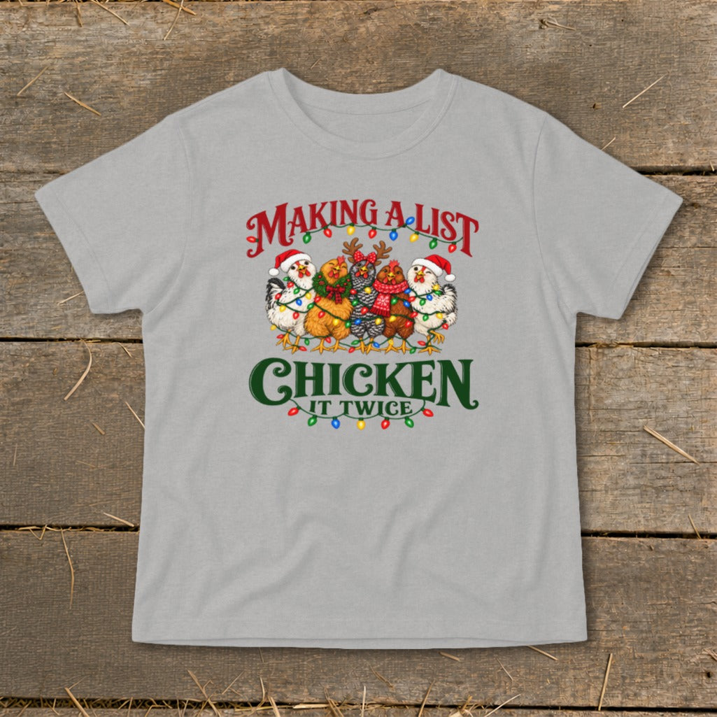Chickens wearing Santa hats and scarves with Christmas lights say "Making a list, chicken it twice."