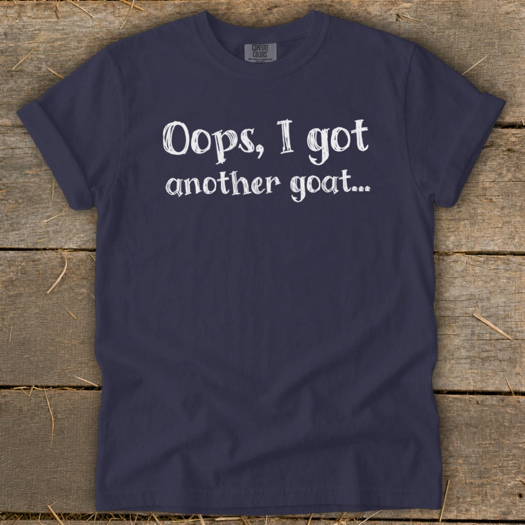 Navy t-shirt with white text reading "Oops, I got another goat..."