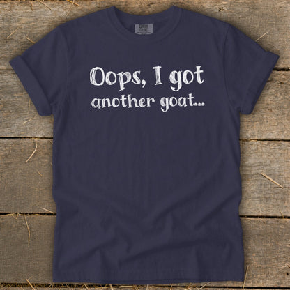 Navy t-shirt with white text reading "Oops, I got another goat..."