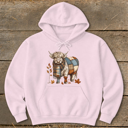 Pink hoodie with a Highland cow wearing a scarf and patchwork blanket.