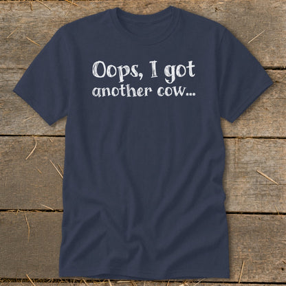 Navy t-shirt with white text "Oops, I got another cow..."
