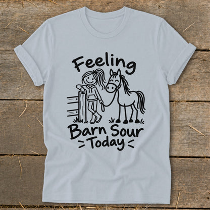 Light blue t-shirt with "Feeling Barn Sour Today" text and drawing of a girl with a horse.