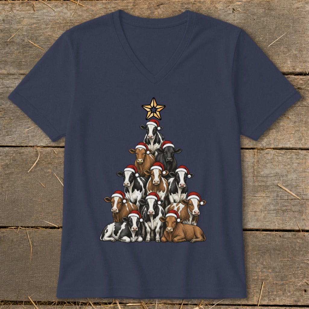 Cows wearing Santa hats arranged in a Christmas tree shape, topped with a star.