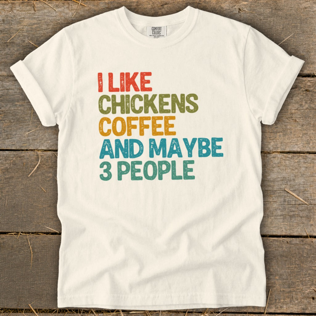Cream t-shirt with text "I LIKE CHICKENS COFFEE AND MAYBE 3 PEOPLE".