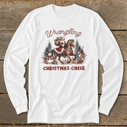 White long-sleeve shirt with "Wrangling Christmas Cheer" graphic of Santa on a horse